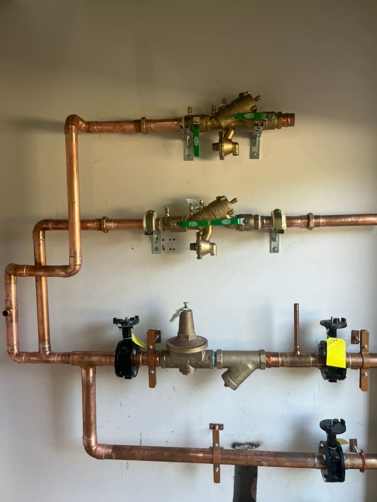 Copper supply piping with brass valves installed by MRJ Plumbing in Asheville, NC