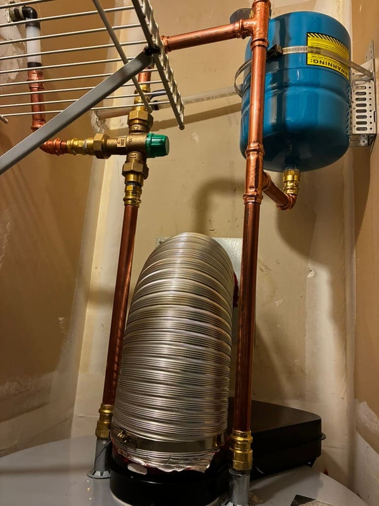 Water heater with copper piping and expansion tank installed by MRJ Plumbing in Asheville, NC