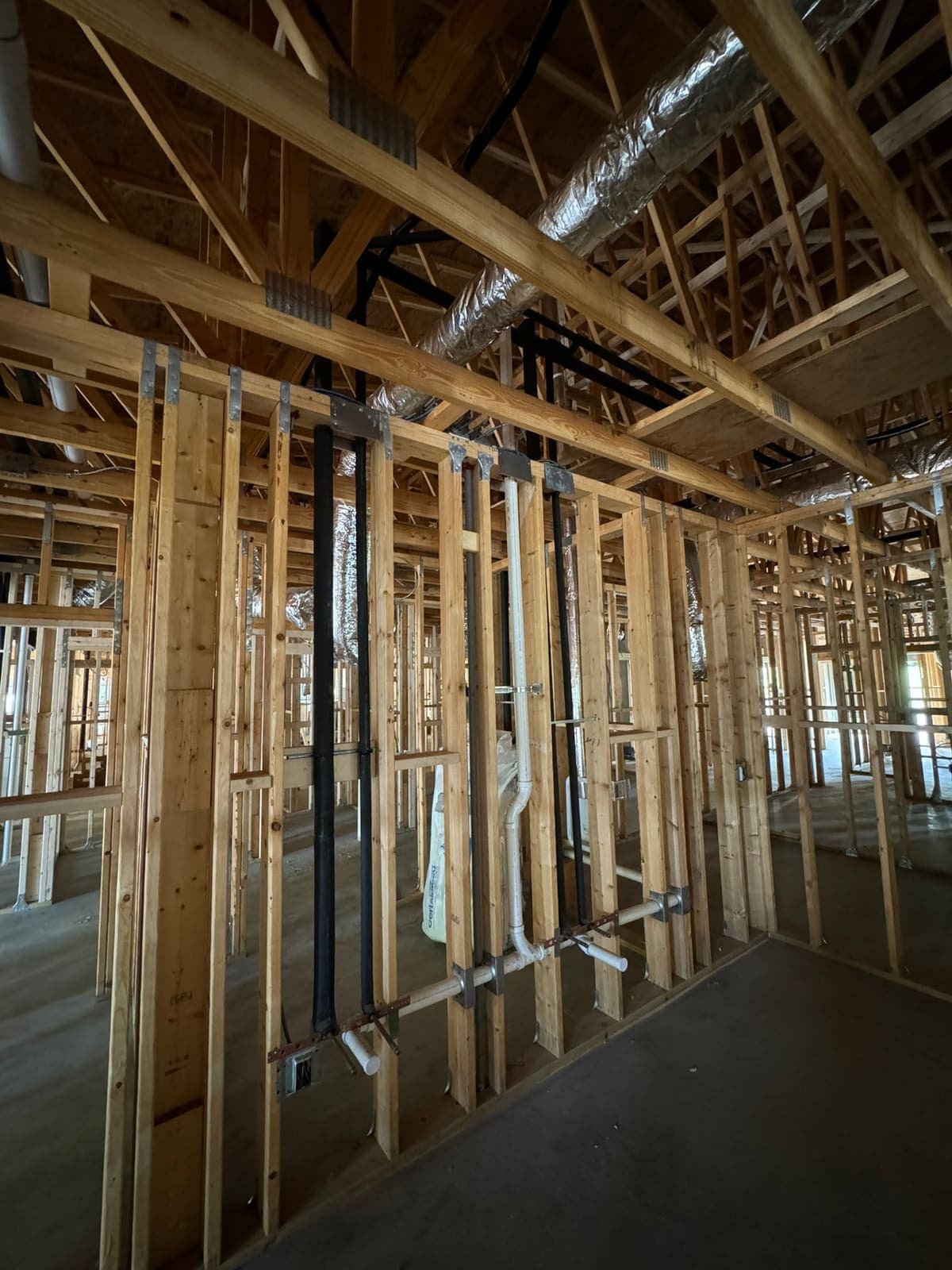 Drain and vent rough-in in new framing, a plumbing job by MRJ Plumbing in the Asheville, NC area