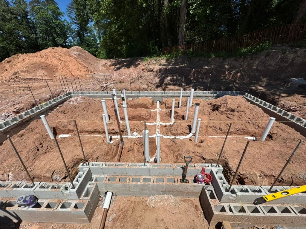 Under-slab rough-in before the pour, a plumbing job by MRJ Plumbing in the Asheville, NC area