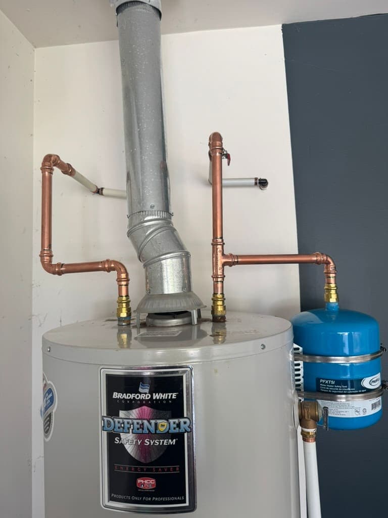 Gas water heater with copper piping and expansion tank installed by MRJ Plumbing in Asheville, NC